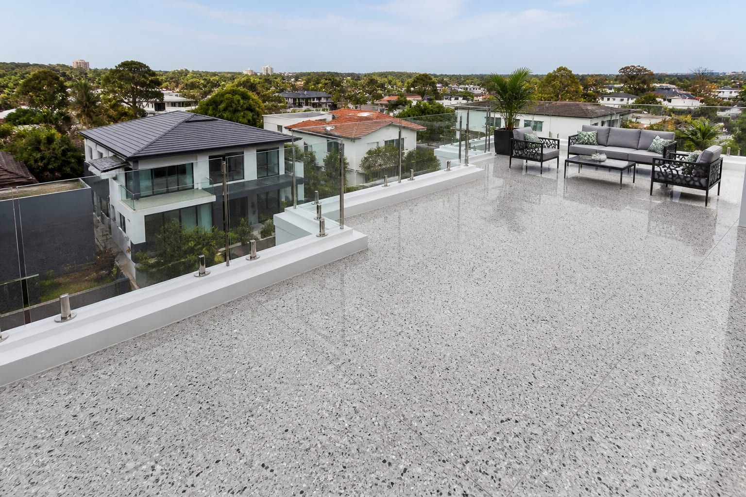High-gloss polished terrazzo flooring on a modern rooftop terrace